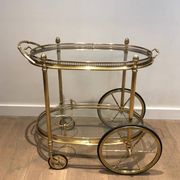 Oval brass trolley from Maison Baguès.