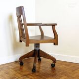 Oak wood office chair with swivel seat and swivel wheels