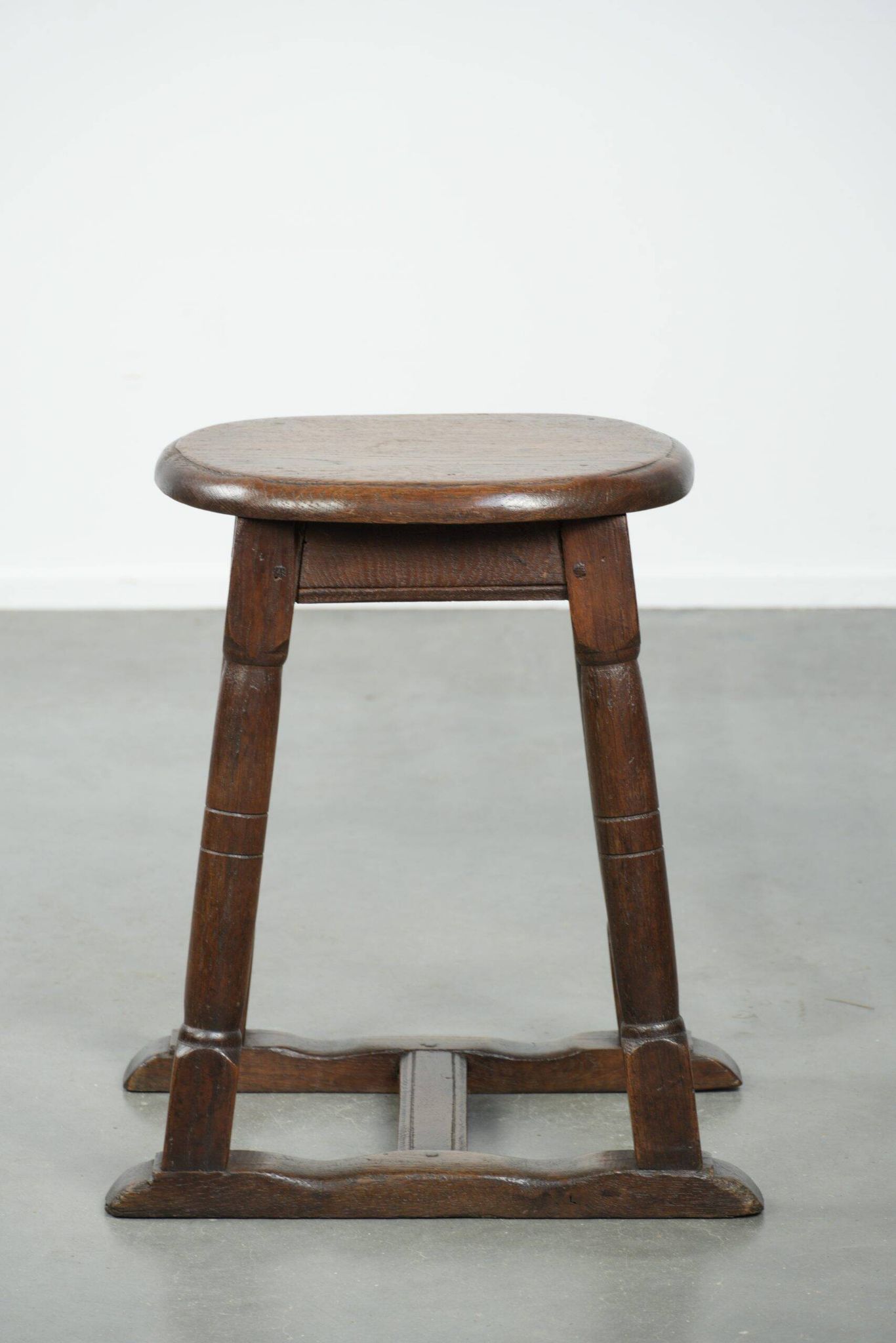 Antique Dutch oak stool from the early 19th century with a nice design