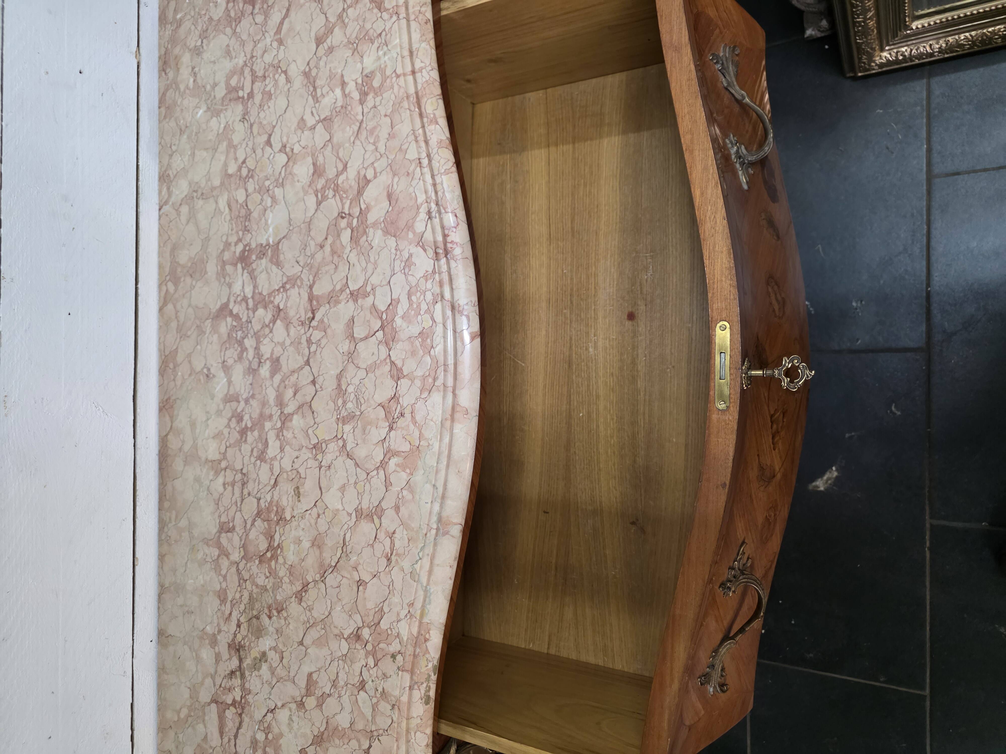Louis XV style curved chest of drawers in marquetry