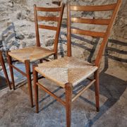 Set of 4 mid-century Italian dining chairs with woven seats, circa 1950–1970.