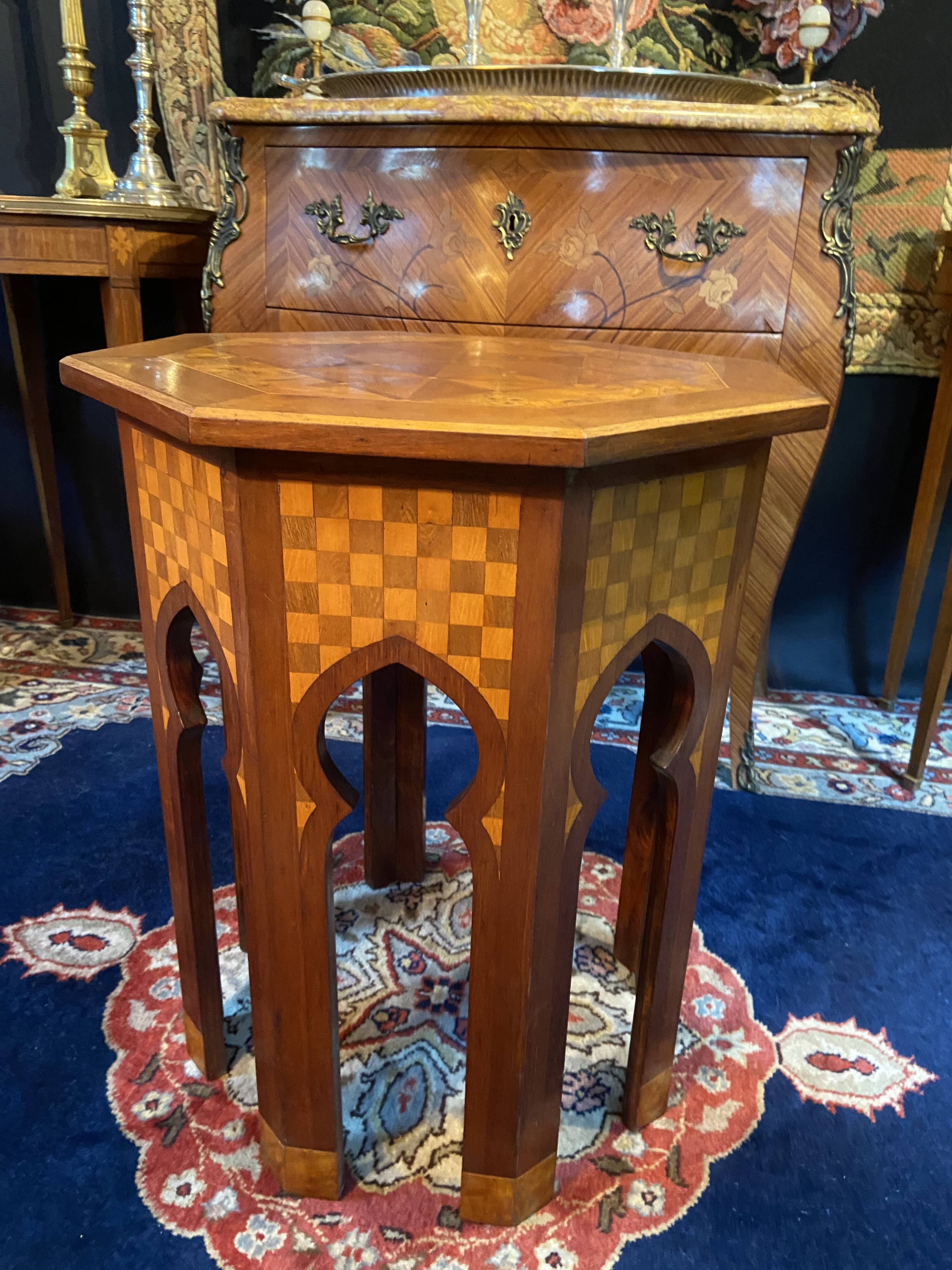 Thuyawood tea table with marquetry decoration.