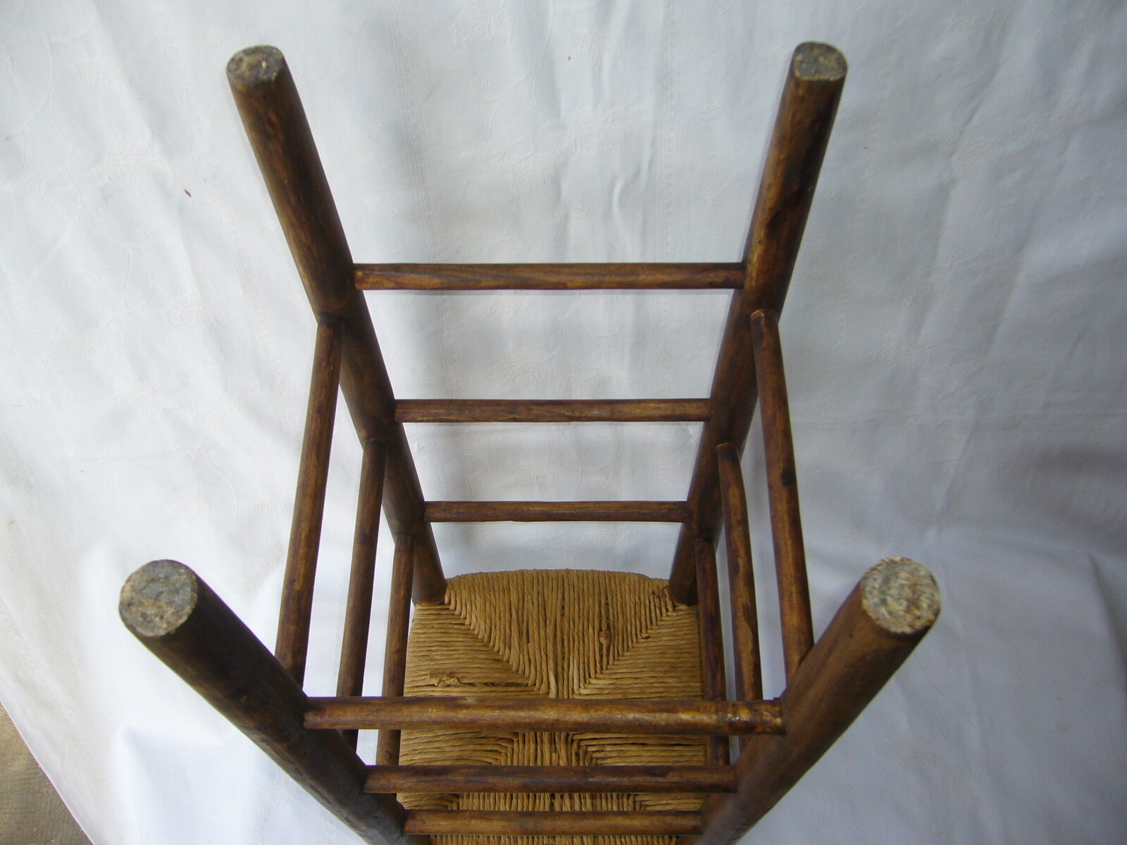 Ancient wooden and straw stool