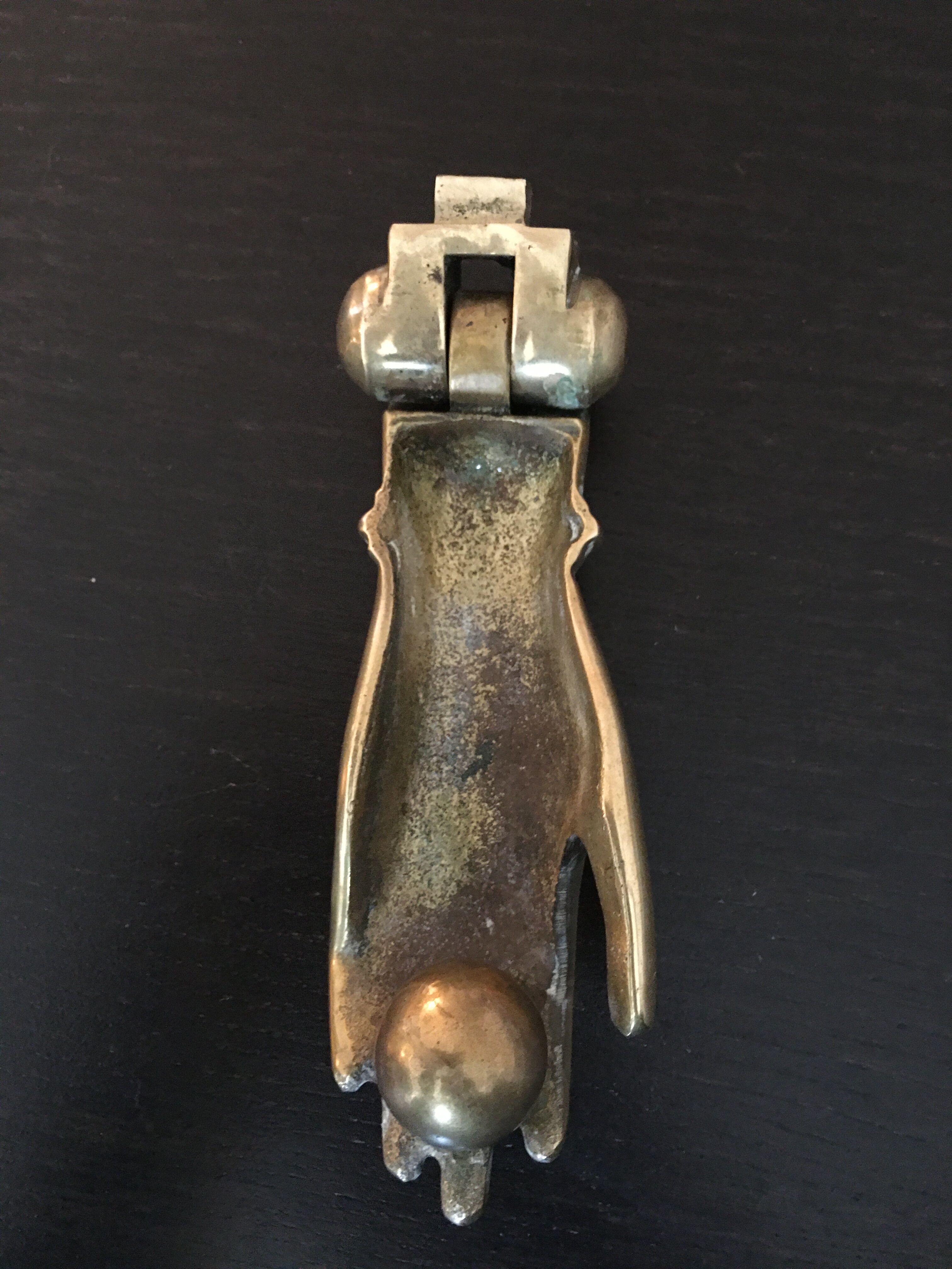 Hand brass paperweight