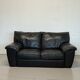 Two-seater black leather sofa — postmodern design