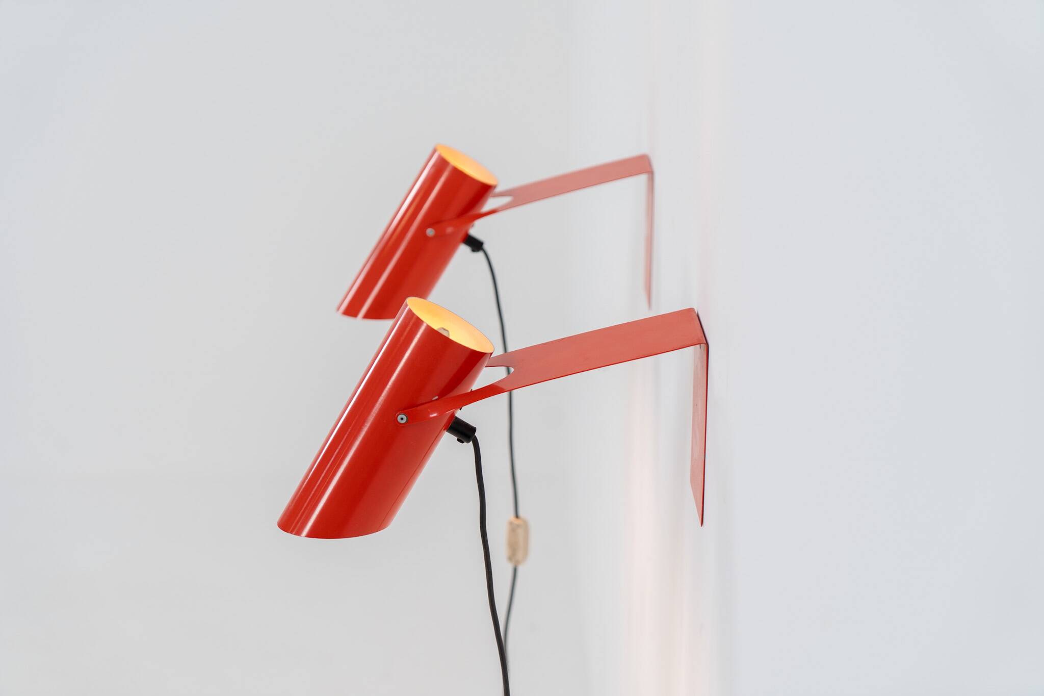 Pair of red metal wall lights
