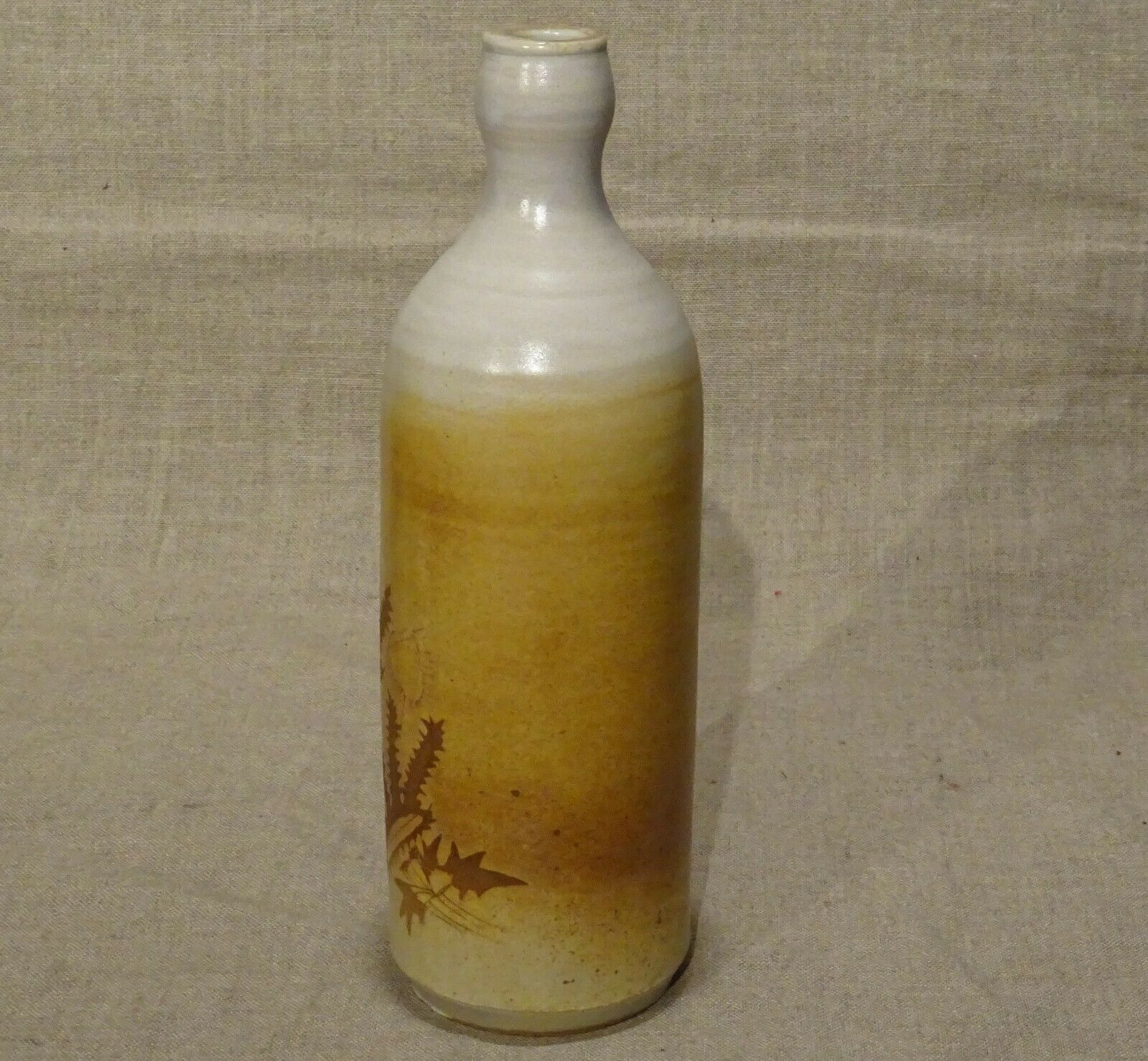 Bottle decorated with Vallauris foliage