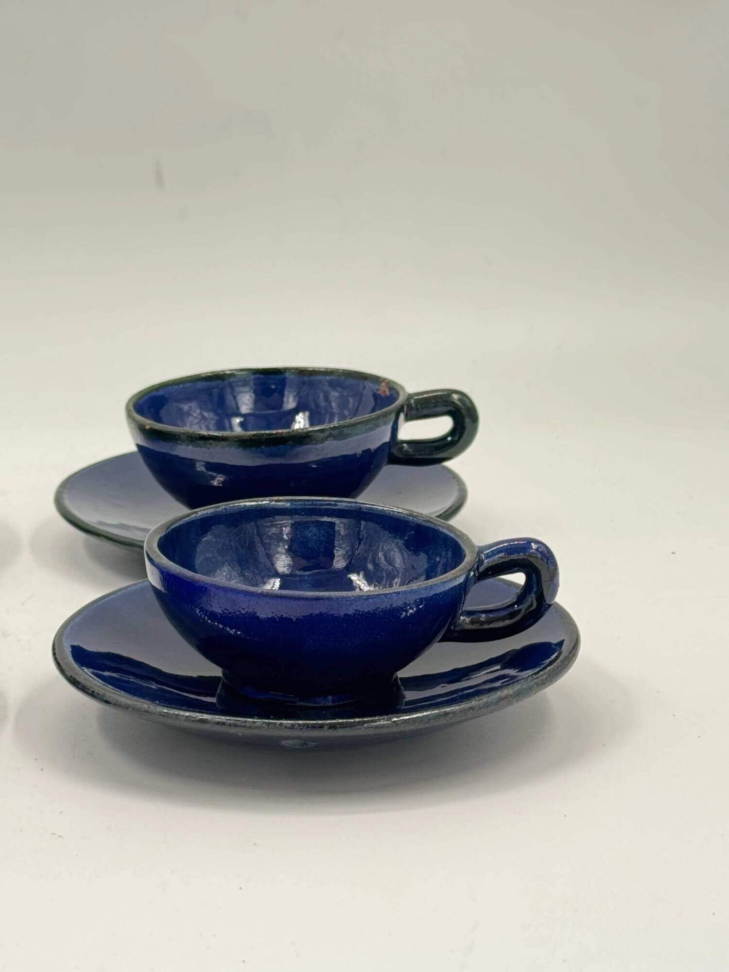 Set of 4 vintage ceramic cups and saucers, cobalt blue glaze.