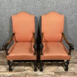 Pair of Louis XIII style armchairs in carved walnut circa 1850