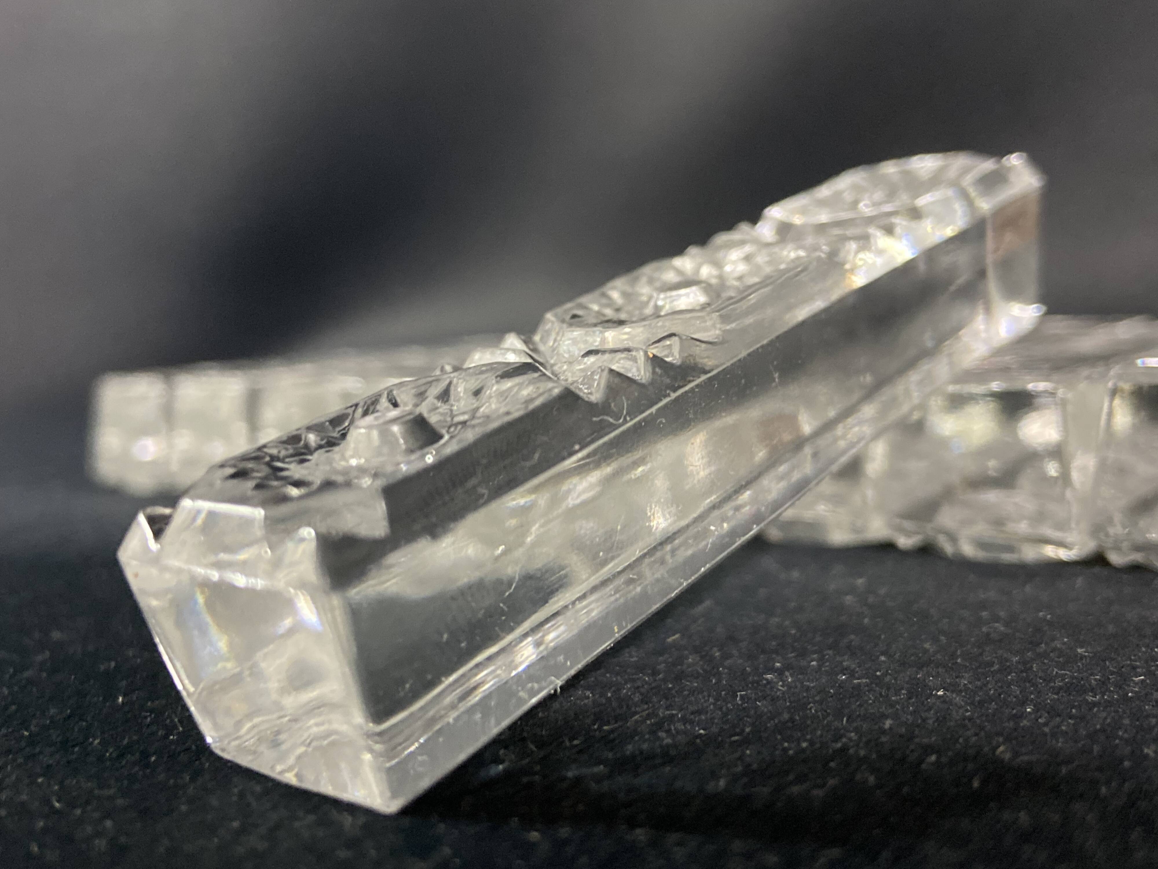 Set of 12 molded glass or crystal knife rests with diamond point decor