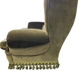 Vintage green two-seater sofa with fringes