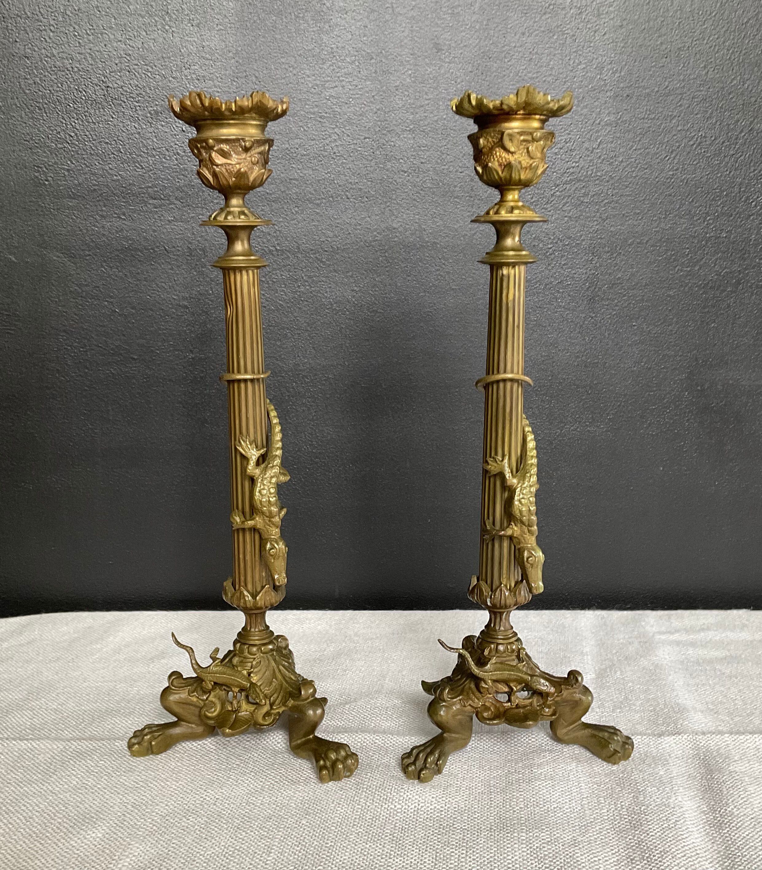 Pair of 19th-century gilded bronze candlesticks in Empire style.