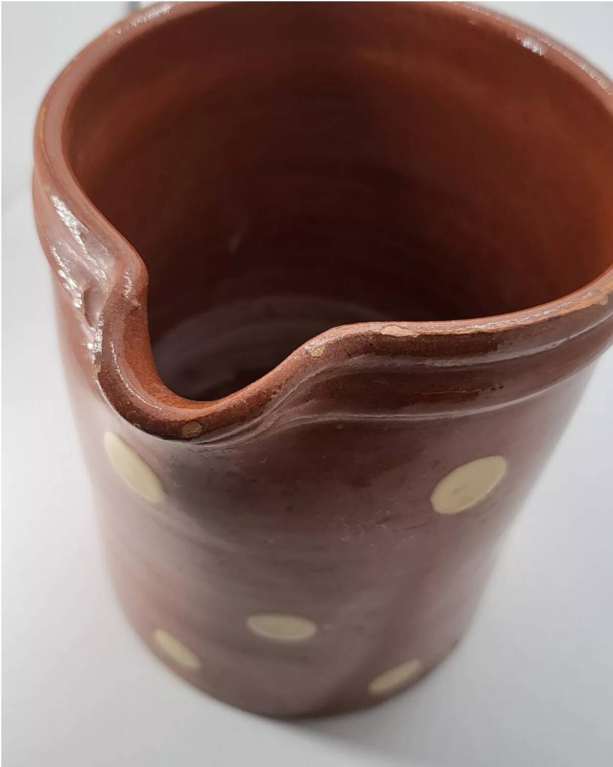 Old pitcher with polka dots savoyard pottery in glazed terracotta alsace