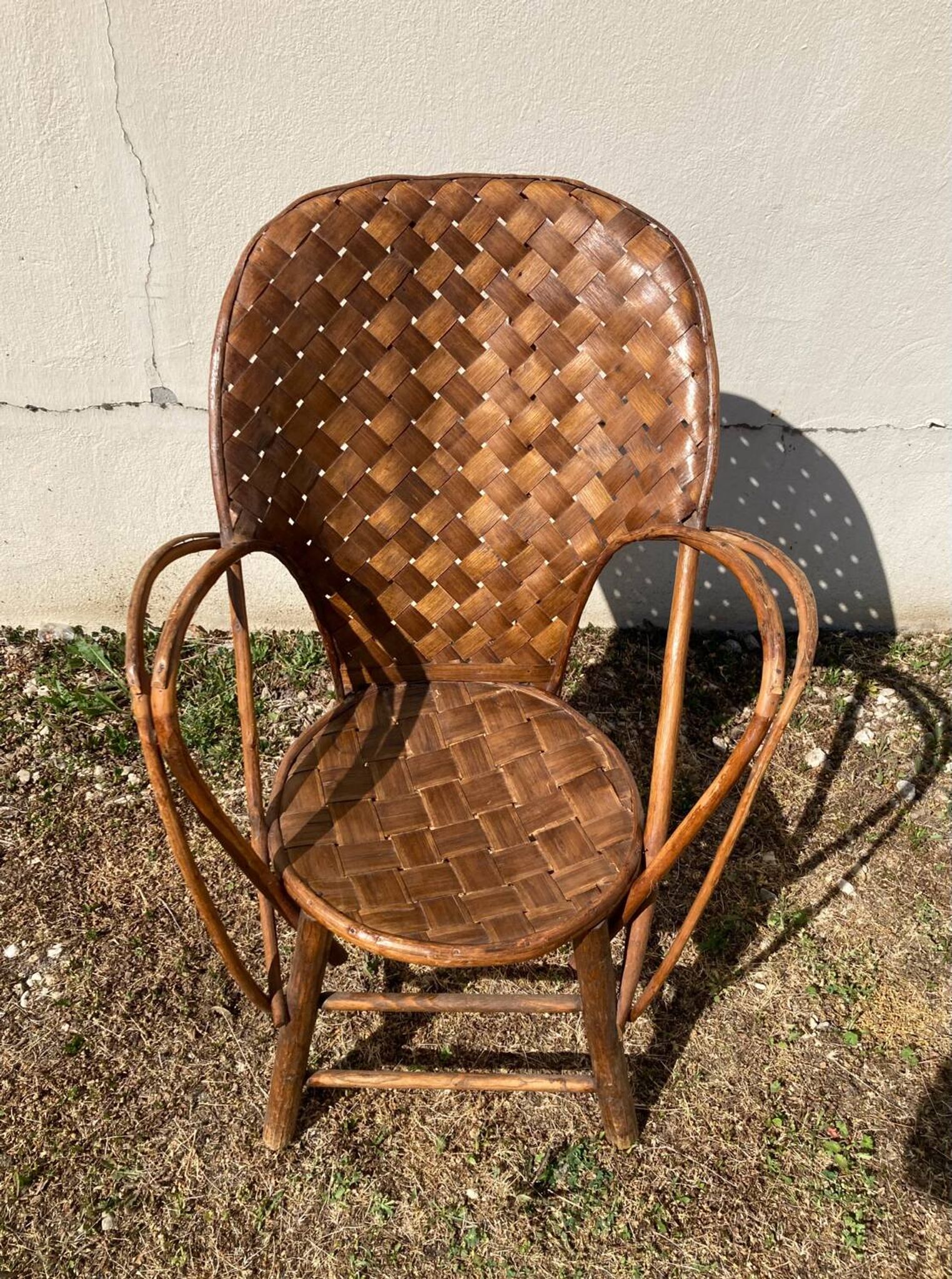 Vintage 1970s armchair in curved woven chestnut + seat cushion