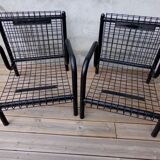 Duo of black armchairs "grilling" metal