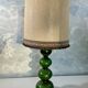 Green ceramic sun lamp/table, Kaiser Leuchten, Germany, 1960s elegance.