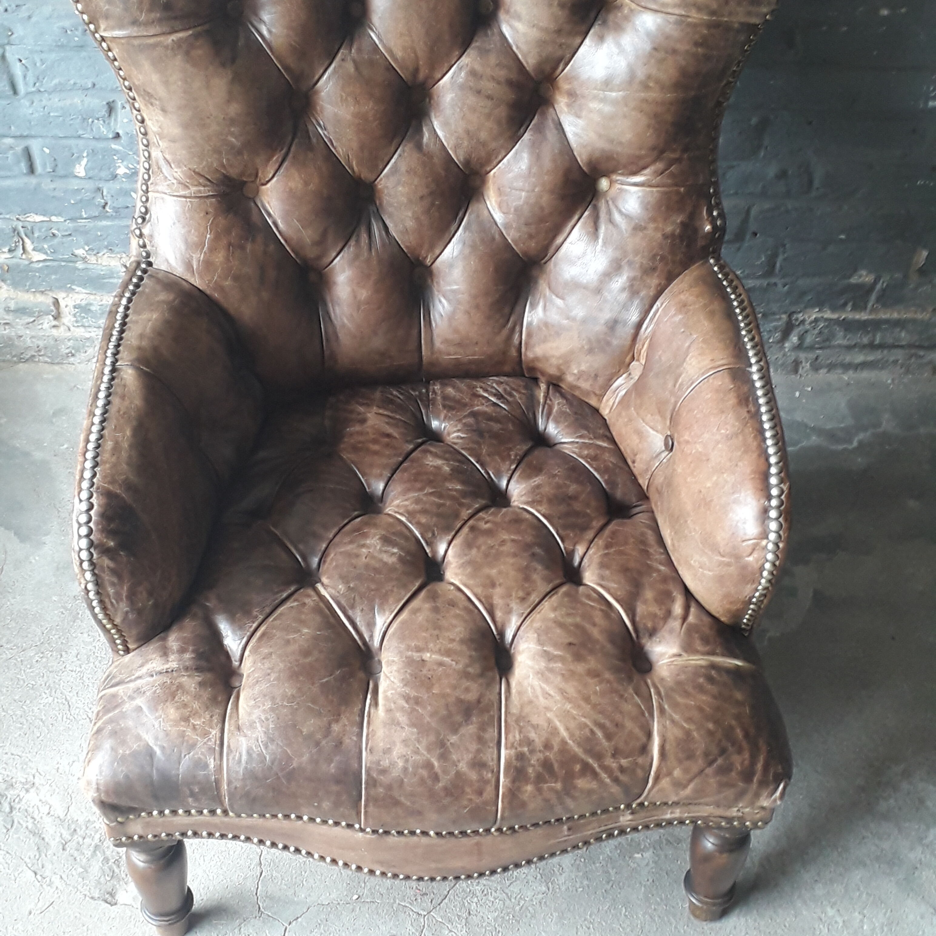 Antique Chesterfield armchair.