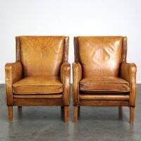 Set of English style light cognac colored leather armchairs.