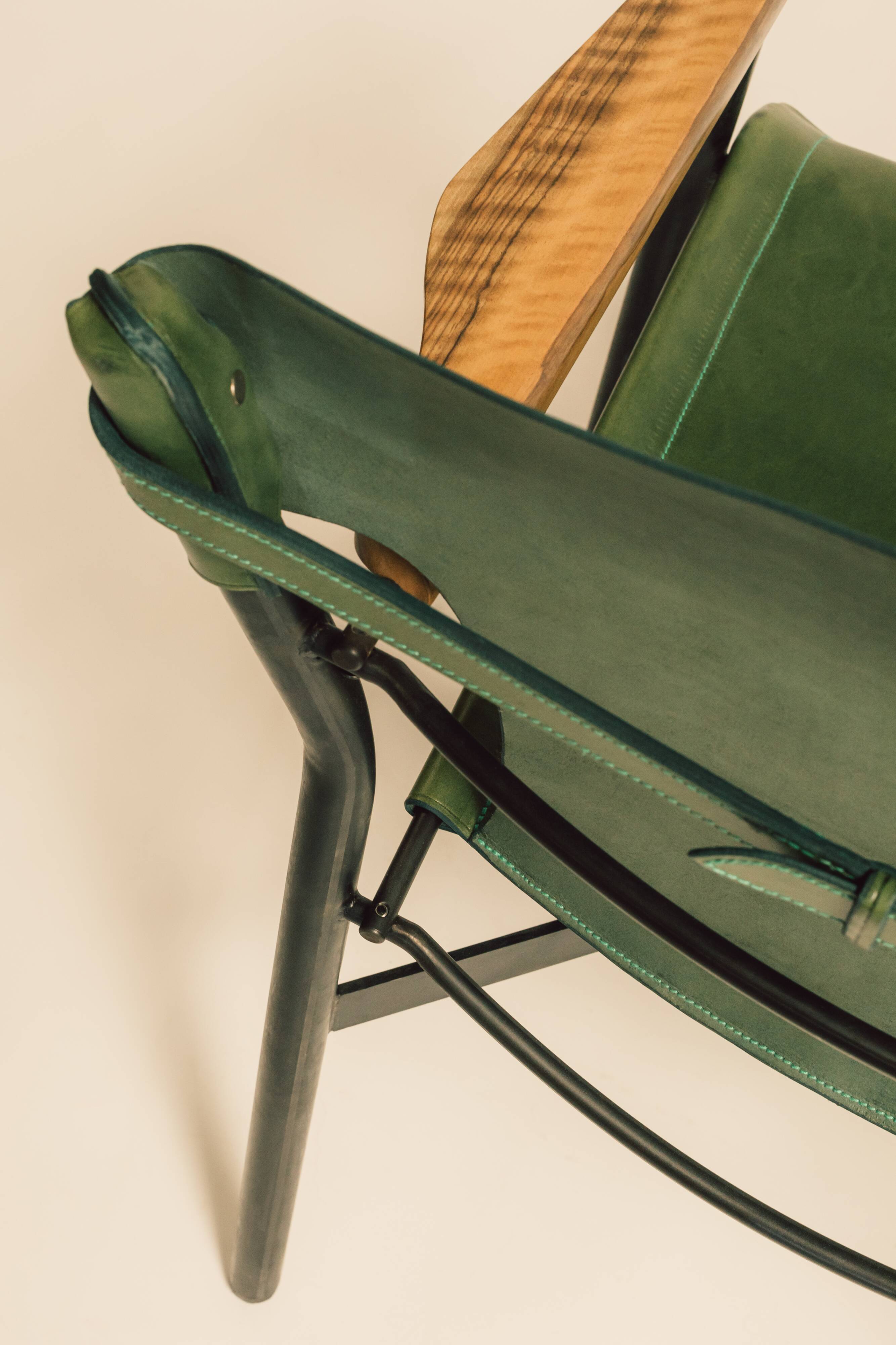 Maërl armchair, Galathée model, green leather, solid wood armrests of your choice