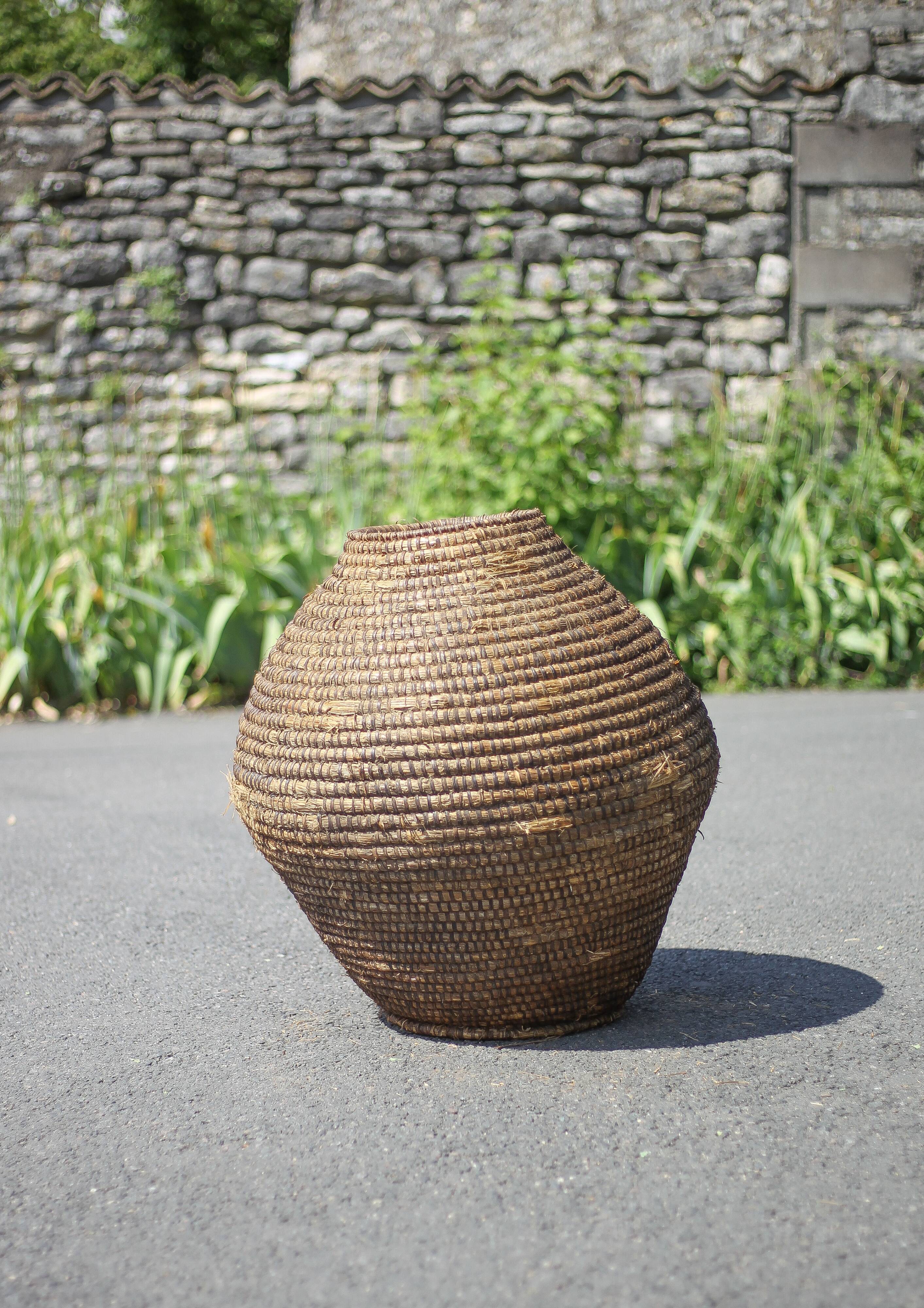 Large old basket, burgundy straw and bramble, woven basket