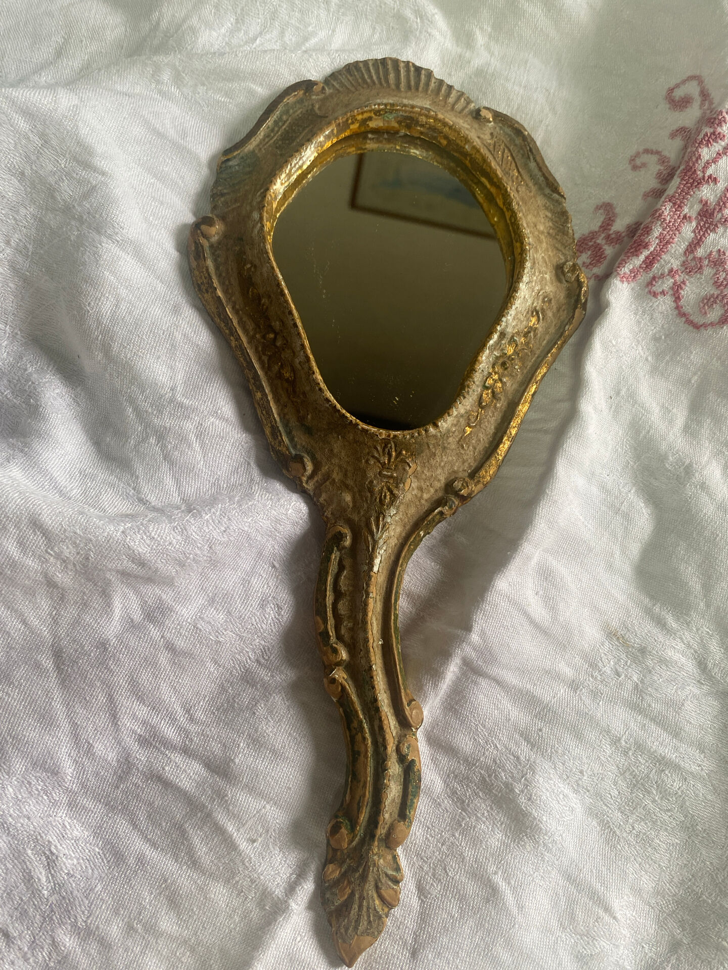Patinated wooden Florentine hand mirror
