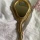Patinated wooden Florentine hand mirror