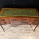 Art Deco desk in curved mahogany veneer.