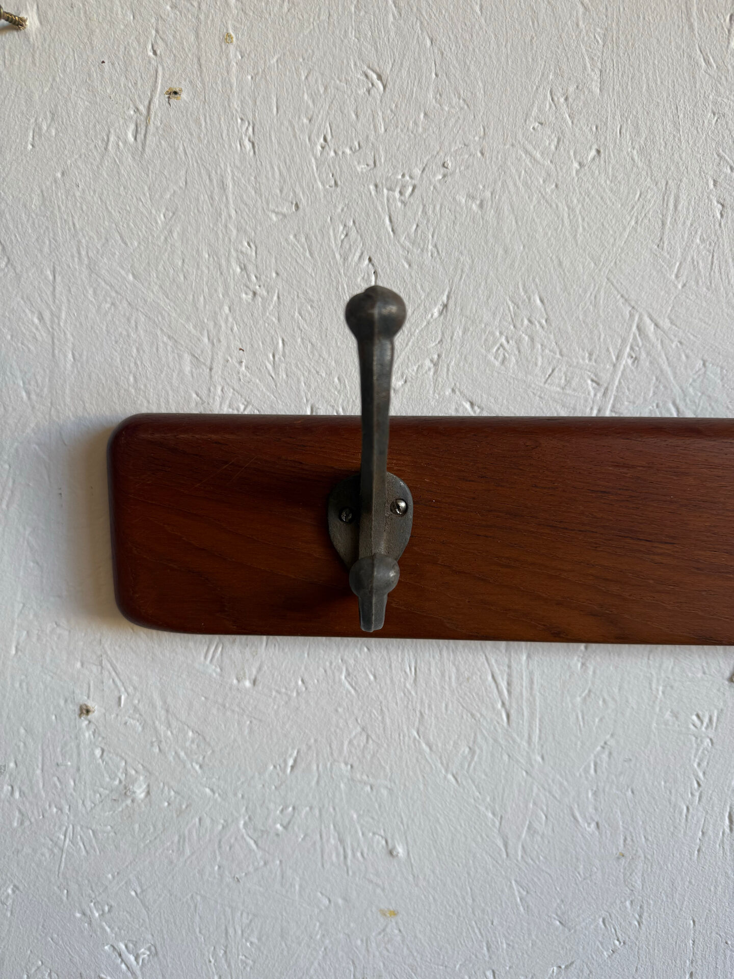 Scandinavian coat rack in solid teak from the 1970s.