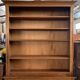 Bibus bookcase of walnut parquet with blonde patina