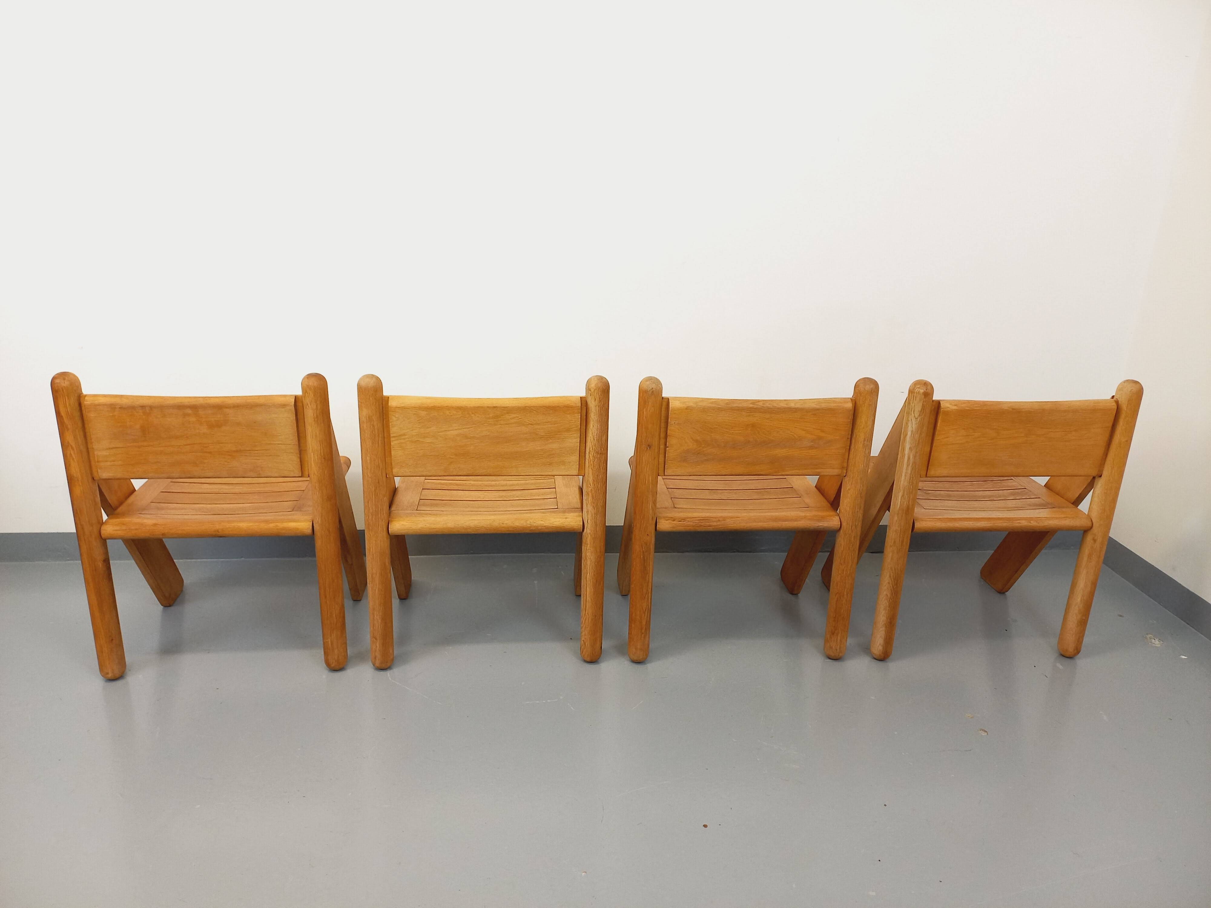 Set of 4 vintage brutalist chairs in solid oak from the 1960s.