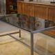 Brushed stainless steel and smoked black glass desk from the 1980s.