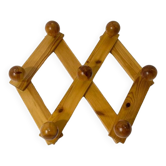 Accordion wall coat rack in solid pine