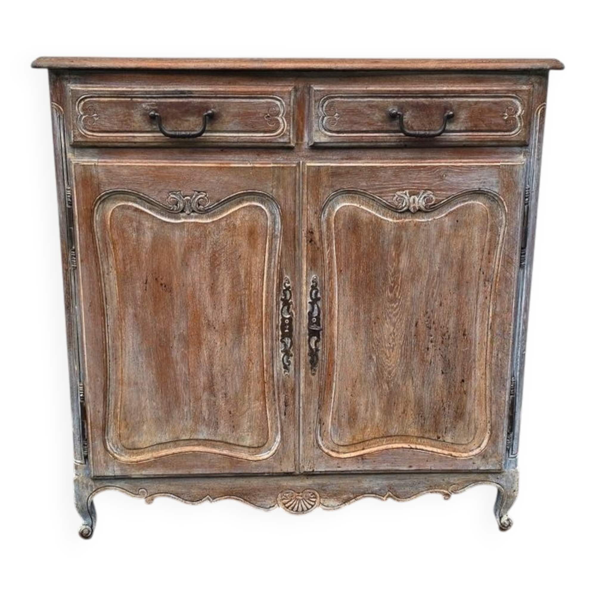 Antique chest of drawers with a cerused and patinated finish.