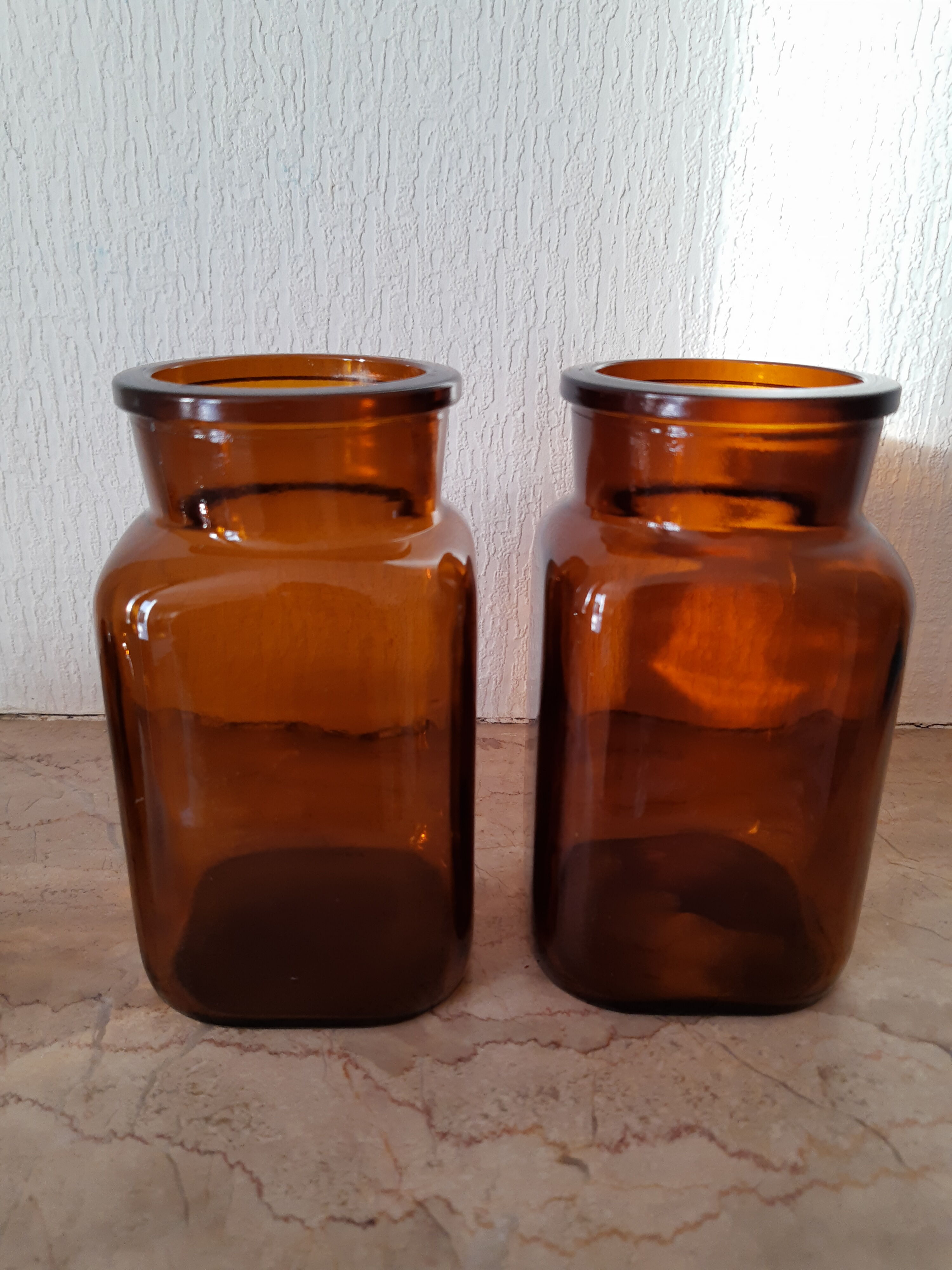 Pair of vintage amber glass jars