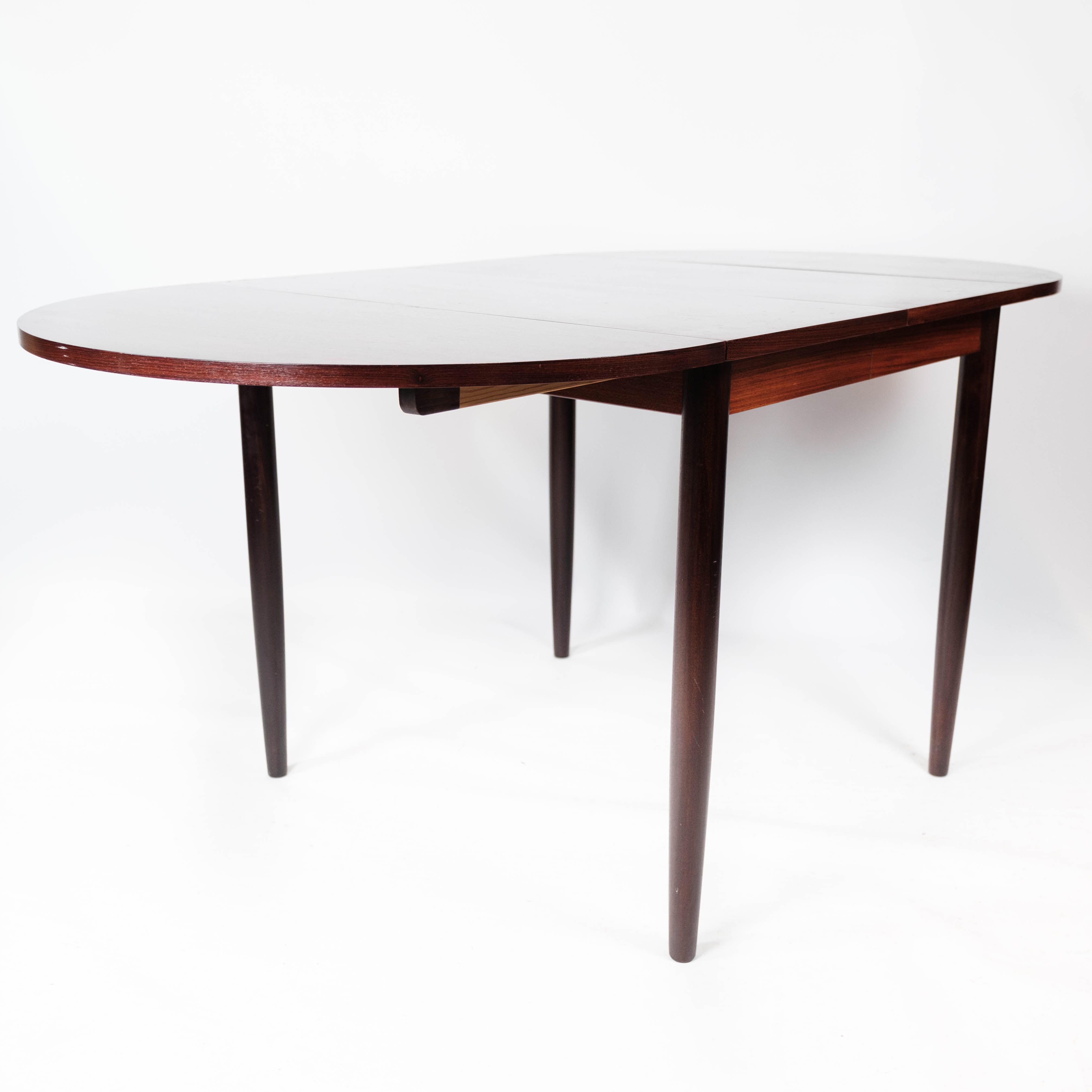 Dining table in rosewood with extension plates, designed by Arne Vodder, 1960s