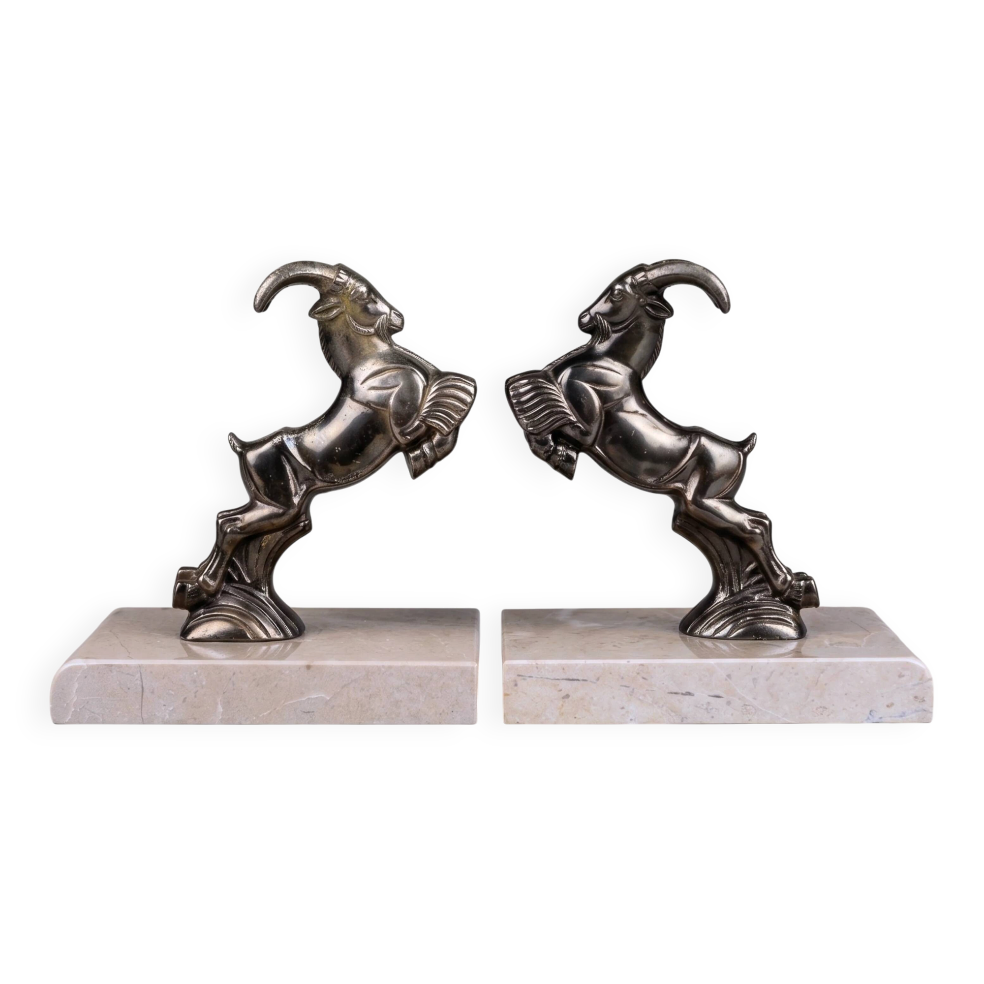 Art Deco bookends with patinated ibex in a taupe marble base.