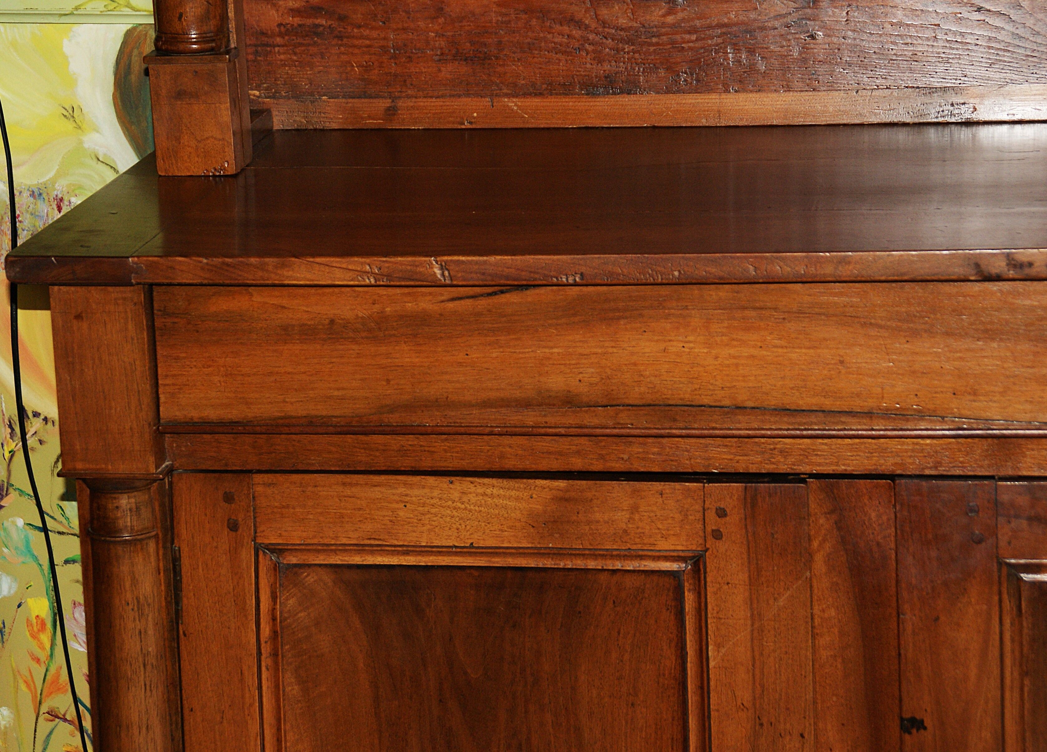 Sideboard with half-columns in walnut, Empire period.