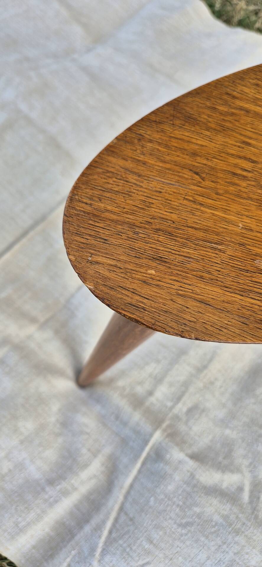 Vintage Scandinavian bean side table with wooden tapered legs.