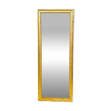 Louis XVI mirror in carved and gilded wood with leaf 18th century