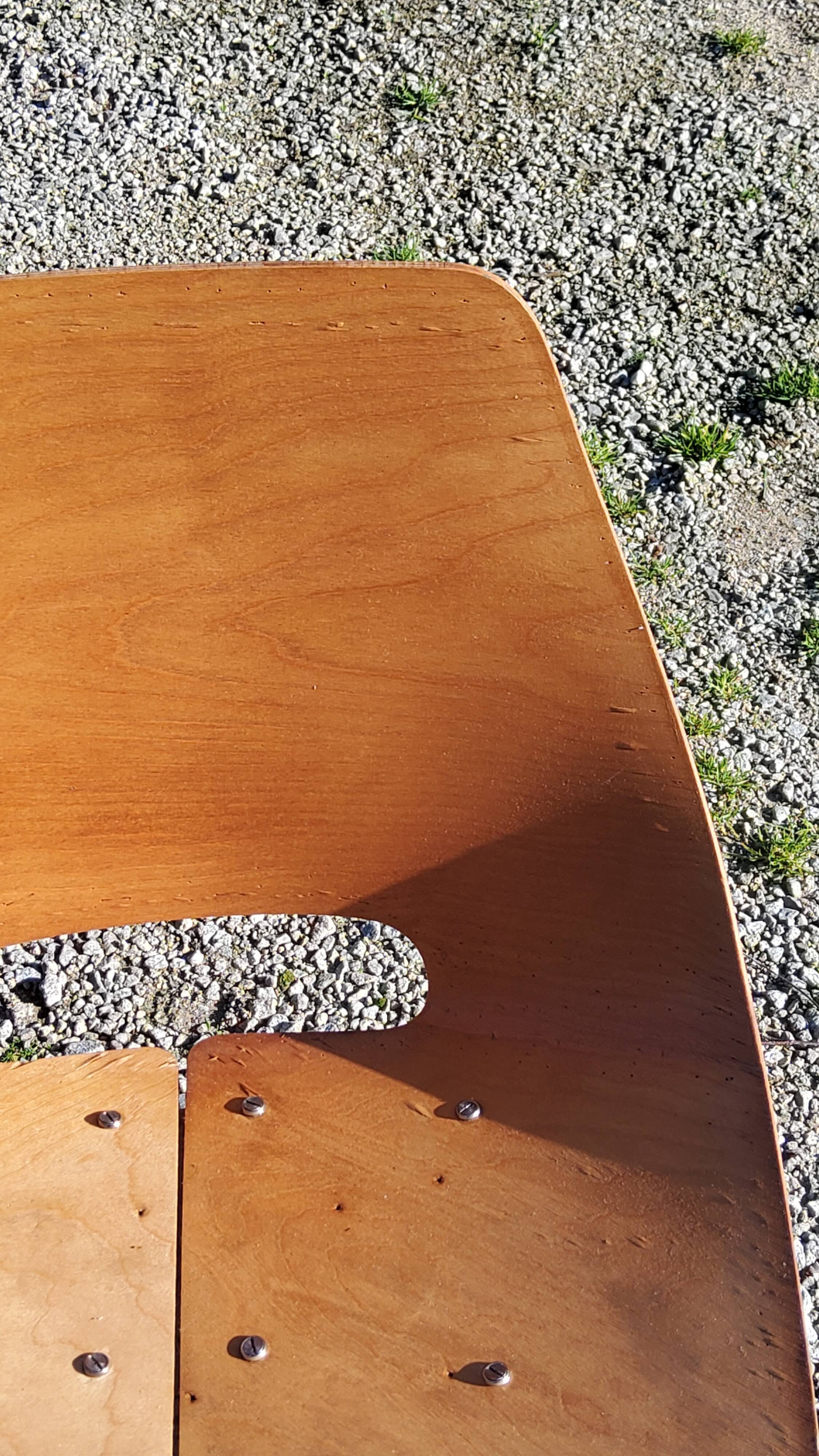Pair of tonneau chairs by Pierre Guariche plywood base tubes 1954