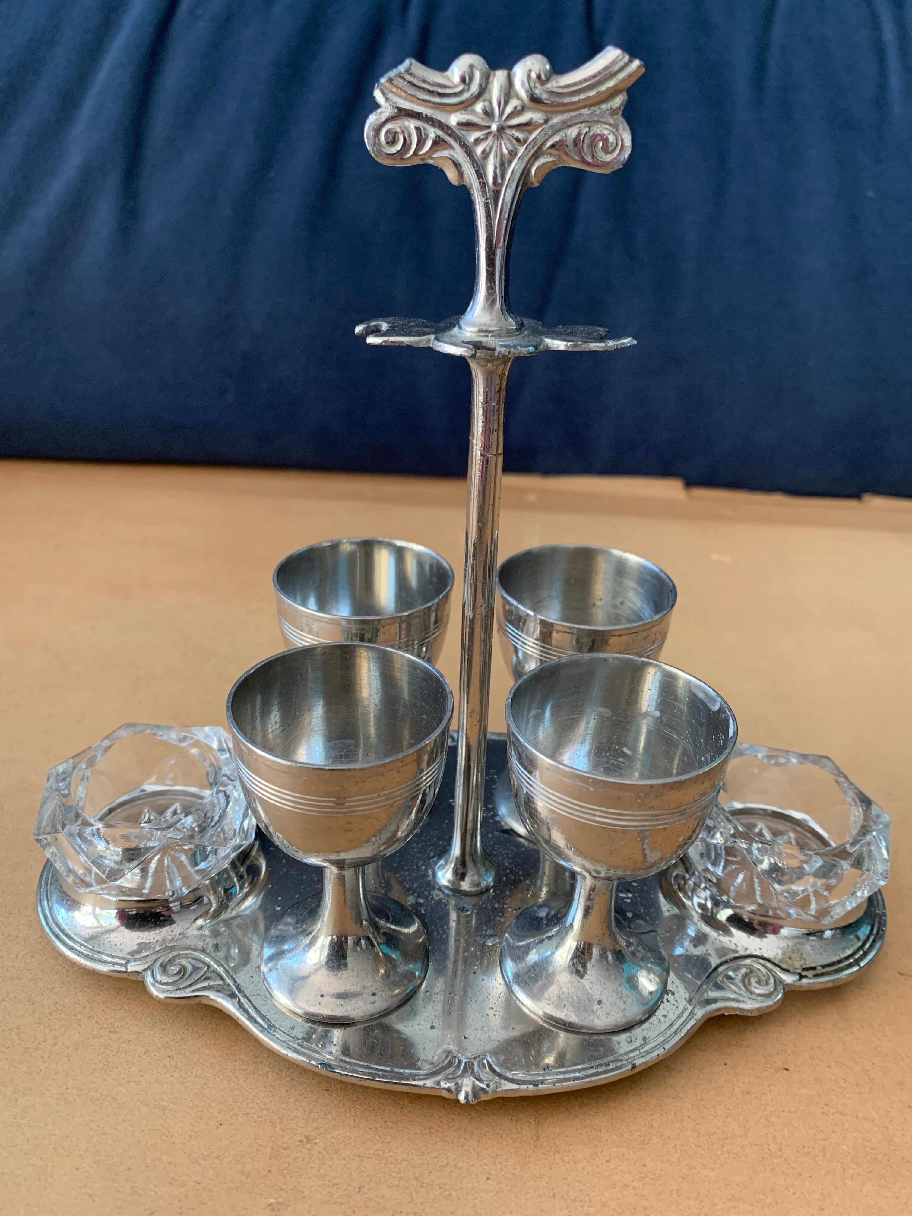 Old serving for boiled eggs with 4 metal cockroaches