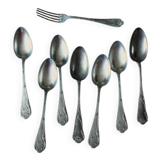 A set of floral metal cutlery: soup spoons and forks