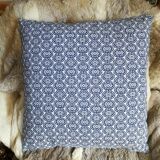 Blue cushion with royal pattern