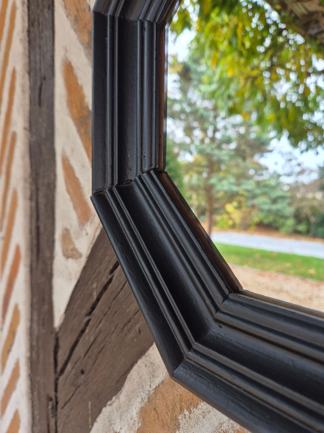 Octagonal black wood mirror