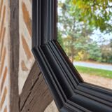 Octagonal black wood mirror