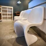 4 white Panton style armchairs