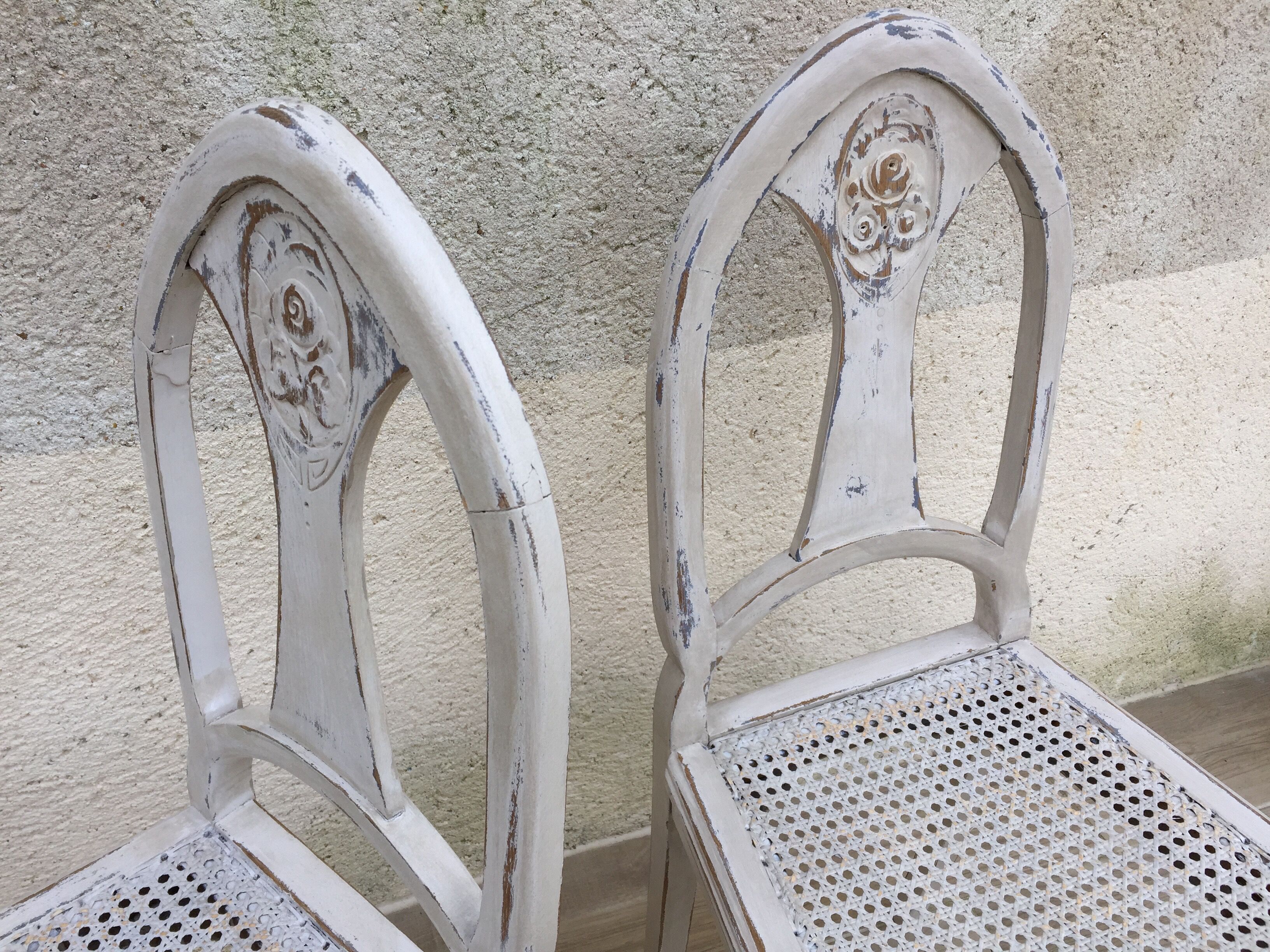 Pair of old white canne chairs