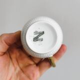 7 Limoges porcelain cups and saucers with gold decoration and floral motif.