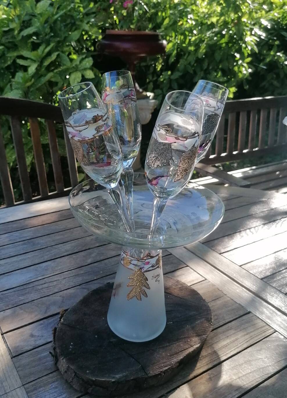 Set of 4 painted blown glass champagne flutes. Signed Denis.