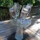 Set of 4 painted blown glass champagne flutes. Signed Denis.